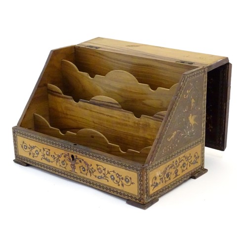 1213 - A 19thC Continental olivewood stationery box with letter rack within, with inlaid decoration depicti... 