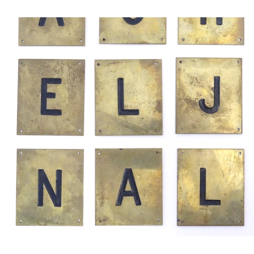 1215 - A quantity of 20thC brass plaques each with an enamel letter, comprising A, O, H, G, C, F, Q, E, L, ... 