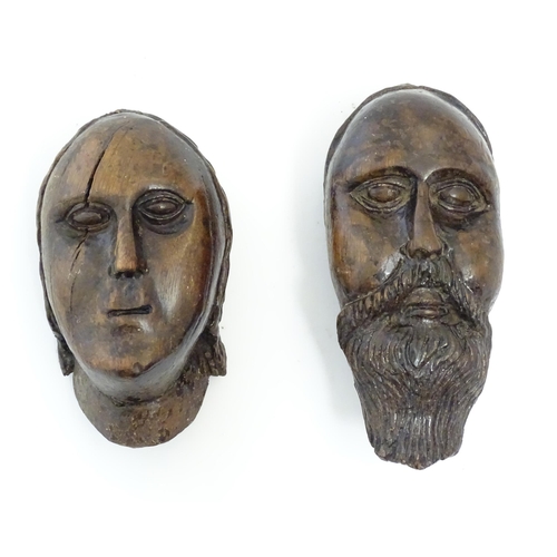 1218 - Two early 19thC Continental folk art carved walnut sculptural faces, one depicting a bearded man, th... 