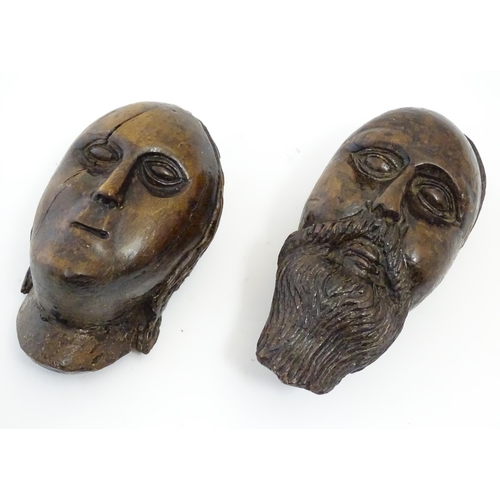 1218 - Two early 19thC Continental folk art carved walnut sculptural faces, one depicting a bearded man, th... 