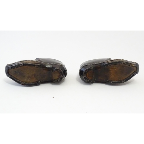 1219 - A pair of 19thC children's leather clogs with stud detail and wooden and metal soles. Approx. 2 1/2