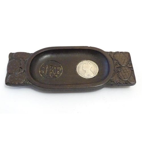 1227 - A Victorian carved wooden twin handled pin dish of oblong form, the handles with stylised acorns and... 