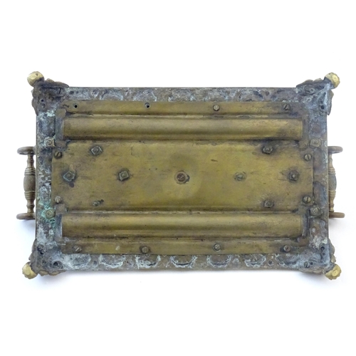 1253 - A Victorian cast brass standish / inkwell of rectangular form with twin scrolling handles and floral... 