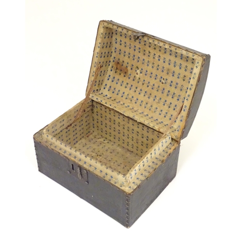 1254 - A 19thC leather covered casket / box with stud detail. Approx. 6 3/4