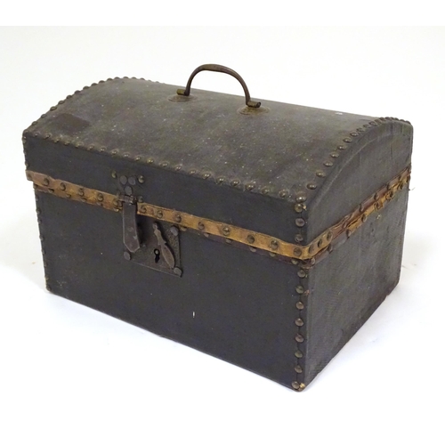 1254 - A 19thC leather covered casket / box with stud detail. Approx. 6 3/4