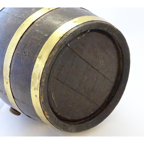 1281 - An early 20thC oak coopered barrel with brass banding. Approx. 17