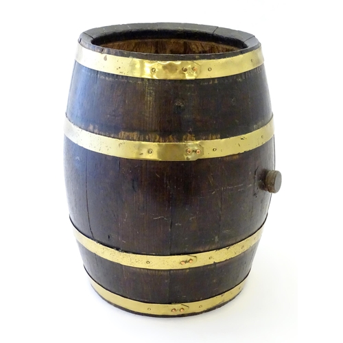 1281 - An early 20thC oak coopered barrel with brass banding. Approx. 17