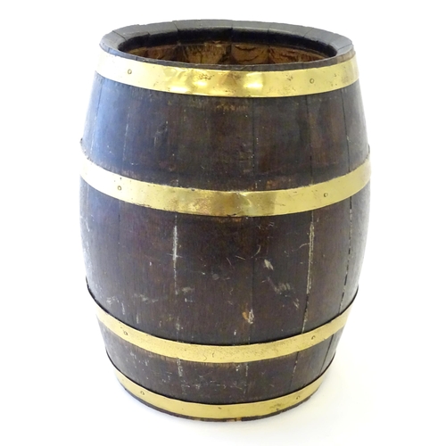 1281 - An early 20thC oak coopered barrel with brass banding. Approx. 17