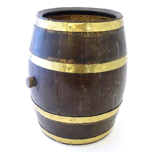 1281 - An early 20thC oak coopered barrel with brass banding. Approx. 17