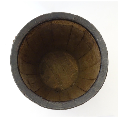 1281 - An early 20thC oak coopered barrel with brass banding. Approx. 17