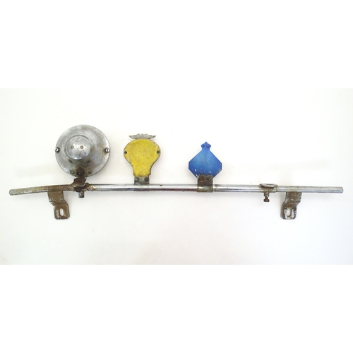 1288 - Automobilia: An early to mid 20thC chromed car / vehicle badge bar, with affixed Lucas 4LR headlamp,... 