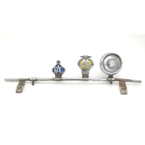 1288 - Automobilia: An early to mid 20thC chromed car / vehicle badge bar, with affixed Lucas 4LR headlamp,... 