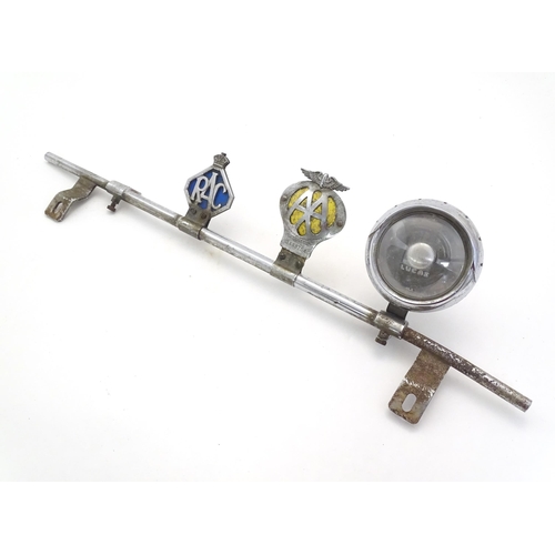 1288 - Automobilia: An early to mid 20thC chromed car / vehicle badge bar, with affixed Lucas 4LR headlamp,... 