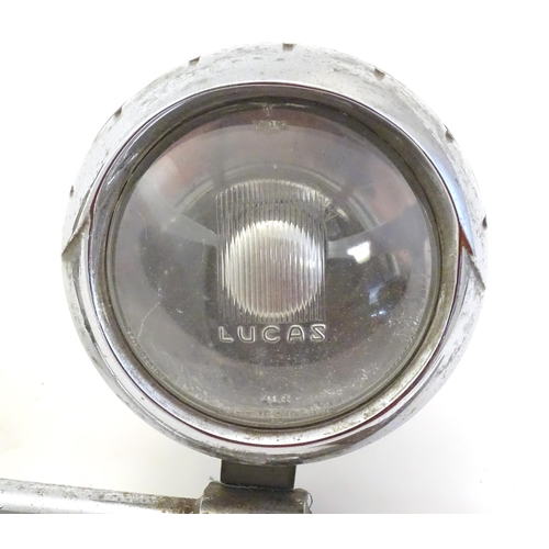 1288 - Automobilia: An early to mid 20thC chromed car / vehicle badge bar, with affixed Lucas 4LR headlamp,... 