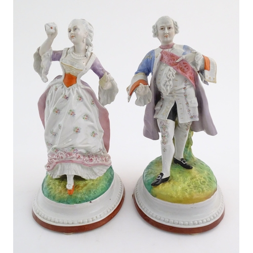 100 - A pair of Continental porcelain figures modelled as a lady and gentleman with flower baskets. Togeth... 