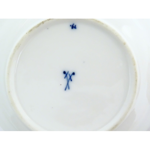 101 - A Meissen blue and white cup and saucer in the onion pattern. With blue crossed sword mark under. Cu... 