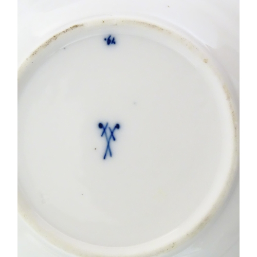 101 - A Meissen blue and white cup and saucer in the onion pattern. With blue crossed sword mark under. Cu... 