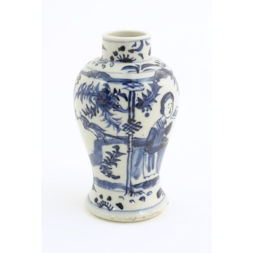 18 - A small Chinese blue and white vase decorated with figures on a garden terrace with flowers and bird... 