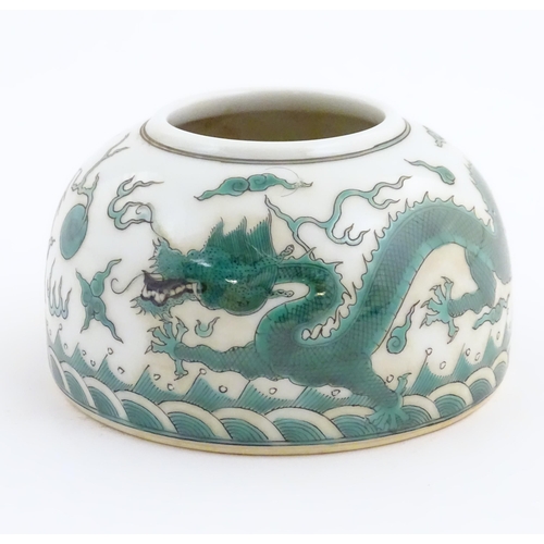 29 - A Chinese brush wash pot of dome form decorated with dragons amongst stylised clouds. Character mark... 