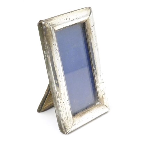 420 - An easel back photograph frame with silver surround hallmarked Birmingham 1913, maker G & C Ltd. App... 