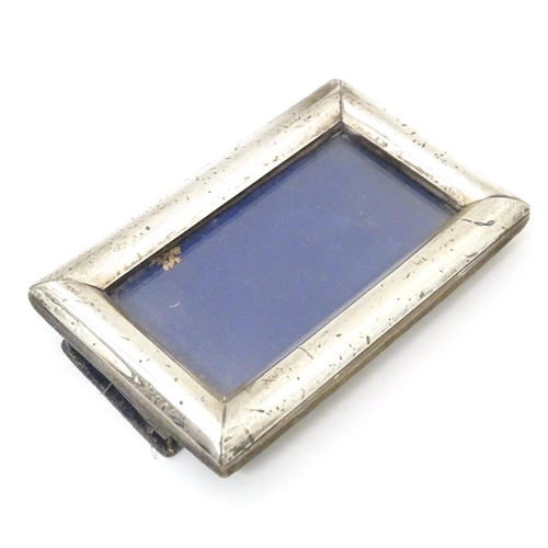 420 - An easel back photograph frame with silver surround hallmarked Birmingham 1913, maker G & C Ltd. App... 