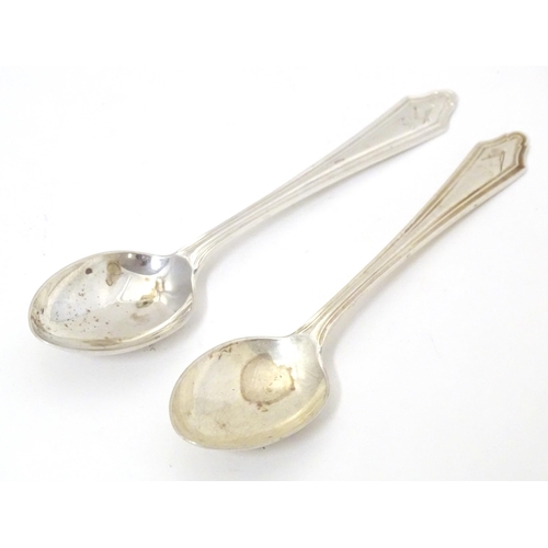 433 - Masonic / Freemasonry interest: A pair of silver teaspoons with engraved masonic emblems to handle a... 