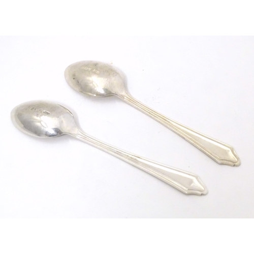 433 - Masonic / Freemasonry interest: A pair of silver teaspoons with engraved masonic emblems to handle a... 