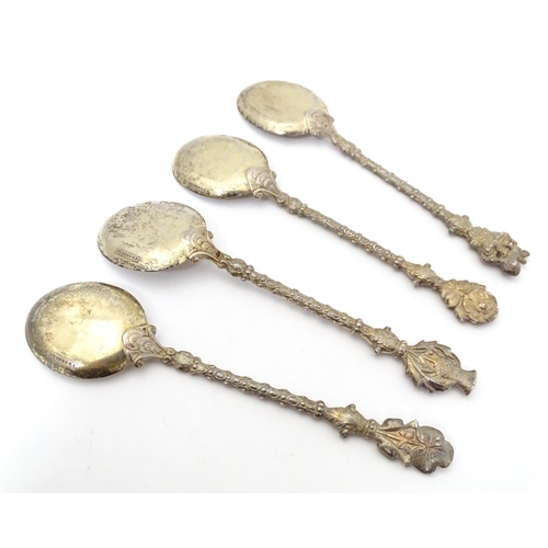 437 - A set of four commemorative coronation Edward VII silver gilt spoons the handles and decorated with ... 