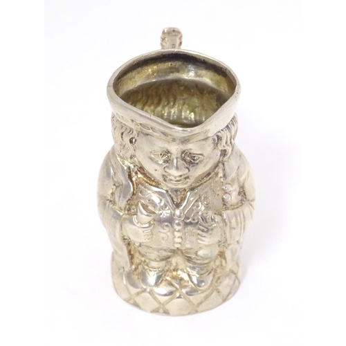 450 - A novelty silver cream jug formed as a miniature Toby character jug, hallmarked with import marks fo... 