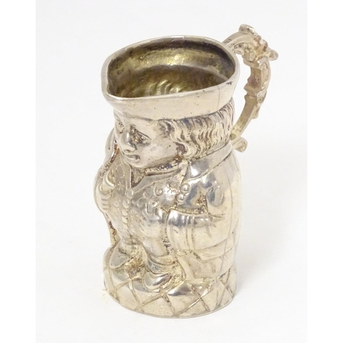 450 - A novelty silver cream jug formed as a miniature Toby character jug, hallmarked with import marks fo... 