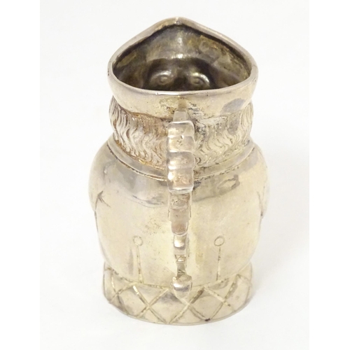 450 - A novelty silver cream jug formed as a miniature Toby character jug, hallmarked with import marks fo... 