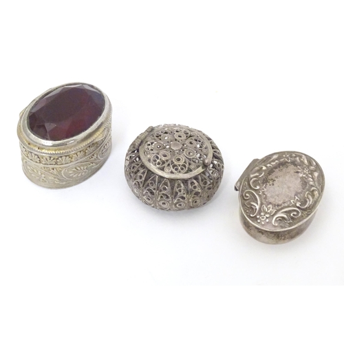 455 - Three various pill boxes, to include one silver example, a silver plate example and a Continental wh... 