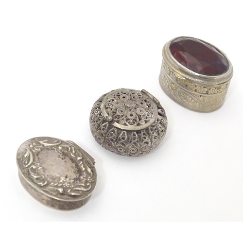 455 - Three various pill boxes, to include one silver example, a silver plate example and a Continental wh... 