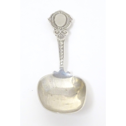 456 - A Victorian silver caddy spoon with oval shield terminal, hallmarked Birmingham 1880, maker George U... 