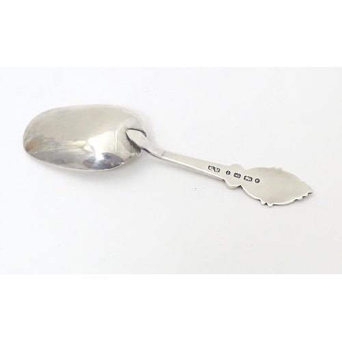 456 - A Victorian silver caddy spoon with oval shield terminal, hallmarked Birmingham 1880, maker George U... 