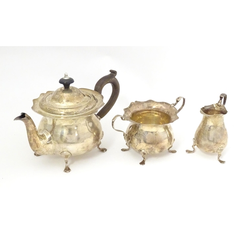 460 - A silver bachelor's tea set comprising teapot, twin handled sugar bowl and milk jug, hallmarked Shef... 