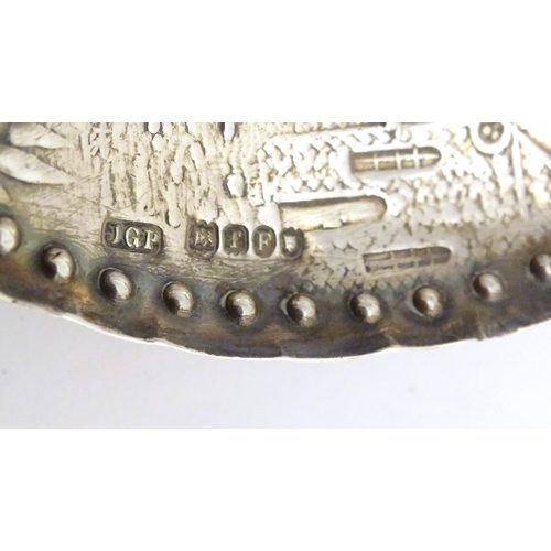 465 - A silver caddy spoon with Dutch landscape scene to bowl, with import marks for London 1901, importer... 