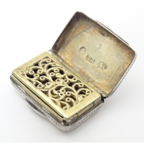 471 - A 19thC silver vinaigrette with engraved decoration opening to reveal gilded interior and grille, ha... 