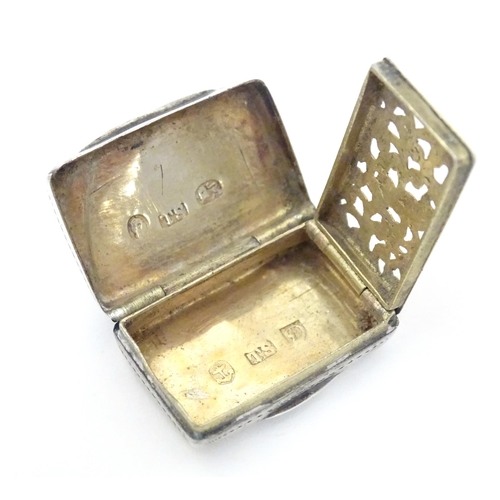 471 - A 19thC silver vinaigrette with engraved decoration opening to reveal gilded interior and grille, ha... 