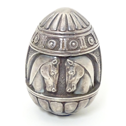 497 - A Continental white metal desk weight of egg form with horse head detail. Marked under Made in Greec... 