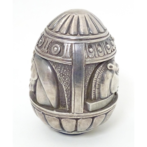 497 - A Continental white metal desk weight of egg form with horse head detail. Marked under Made in Greec... 