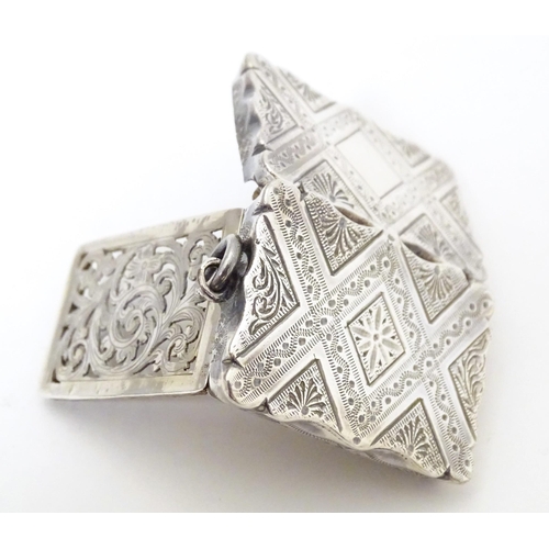 511 - A Victorian silver vinaigrette with engraved decoration opening to reveal grille within, hallmarked ... 