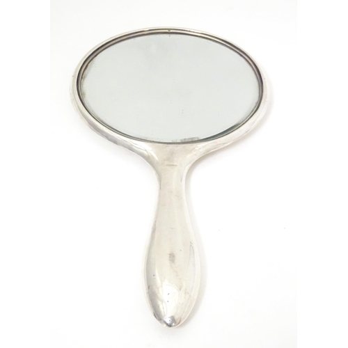 514 - An early 20thC silver hand mirror, hallmarked Birmingham c. 1904 maker B & Co. Approx. 9 1/2