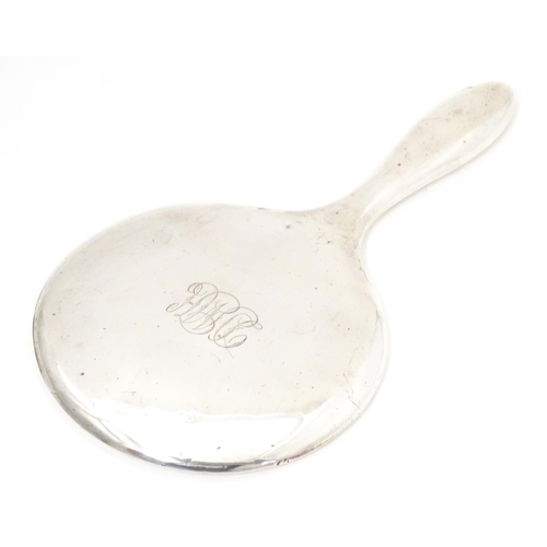 514 - An early 20thC silver hand mirror, hallmarked Birmingham c. 1904 maker B & Co. Approx. 9 1/2