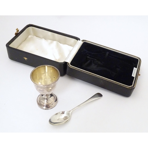 343 - A silver egg cup and spoon, hallmarked Birmingham 1939, maker Arthur Price & Co, cased. The case app... 