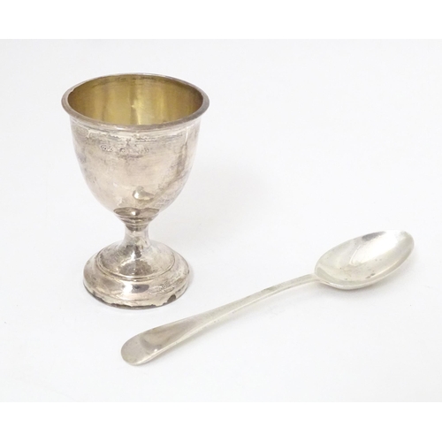 343 - A silver egg cup and spoon, hallmarked Birmingham 1939, maker Arthur Price & Co, cased. The case app... 