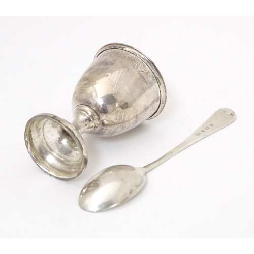 343 - A silver egg cup and spoon, hallmarked Birmingham 1939, maker Arthur Price & Co, cased. The case app... 