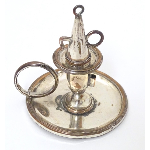 345 - A 19thC silver plate small chamberstick / taper stick holder with snuffer. Approx. 1 3/4