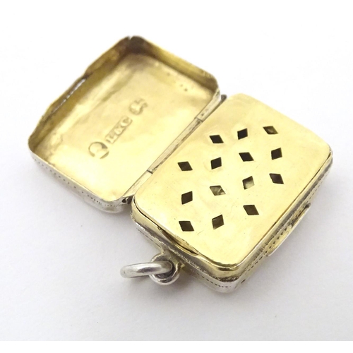 357 - A Geo III silver vinaigrette with engrave decoration opening to reveal gilded grille and interior. H... 