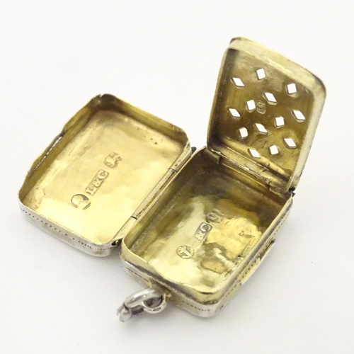 357 - A Geo III silver vinaigrette with engrave decoration opening to reveal gilded grille and interior. H... 